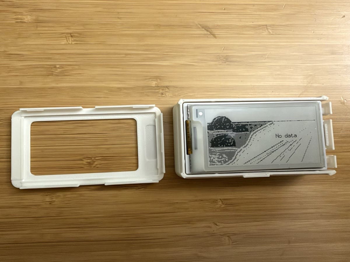 the two halves of the case: snap-on bezel and press-fit base